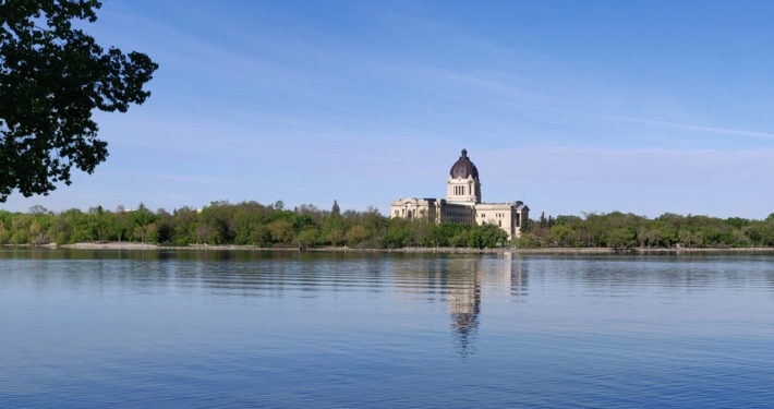 Sask Legislative building with Wascana Lake in the foreground.