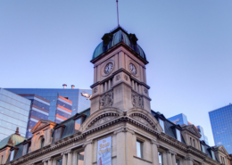 exterior of the globe theatre - the clock tower against Regina Skyline