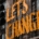 Street sign in orange that reads "Let's Change"